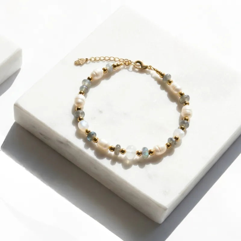 luxe pearl, labradorite, moonstone and pyrite bracelet on a jewelry box — one-of-a-kind crystal jewelry for grounding