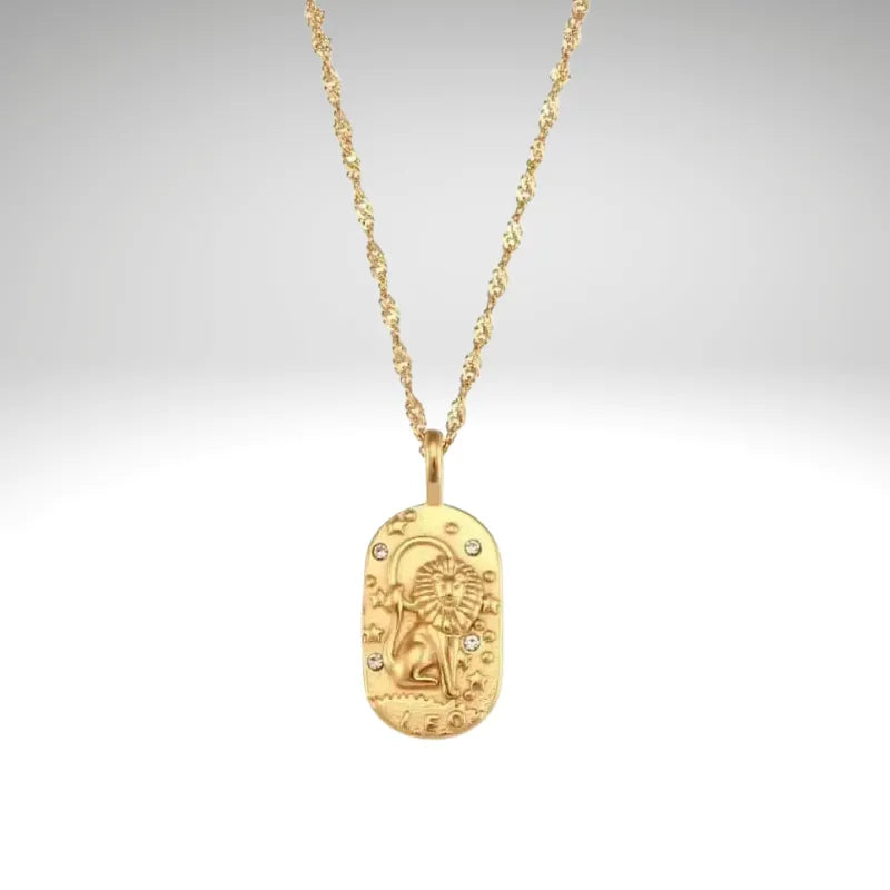 Gold necklace with a pendant on a light gray background