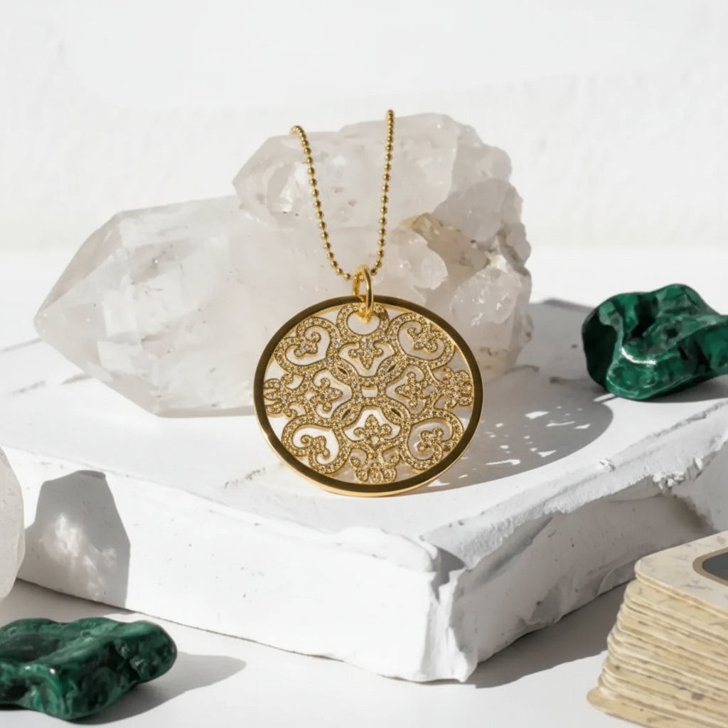 Decorative necklace with intricate design on a white surface with crystals