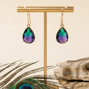 Purple and green ombre drop earrings in gold on a stand, gradient glass jewelry