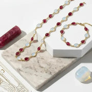 Jewelry set with necklace and bracelet on a marble surface