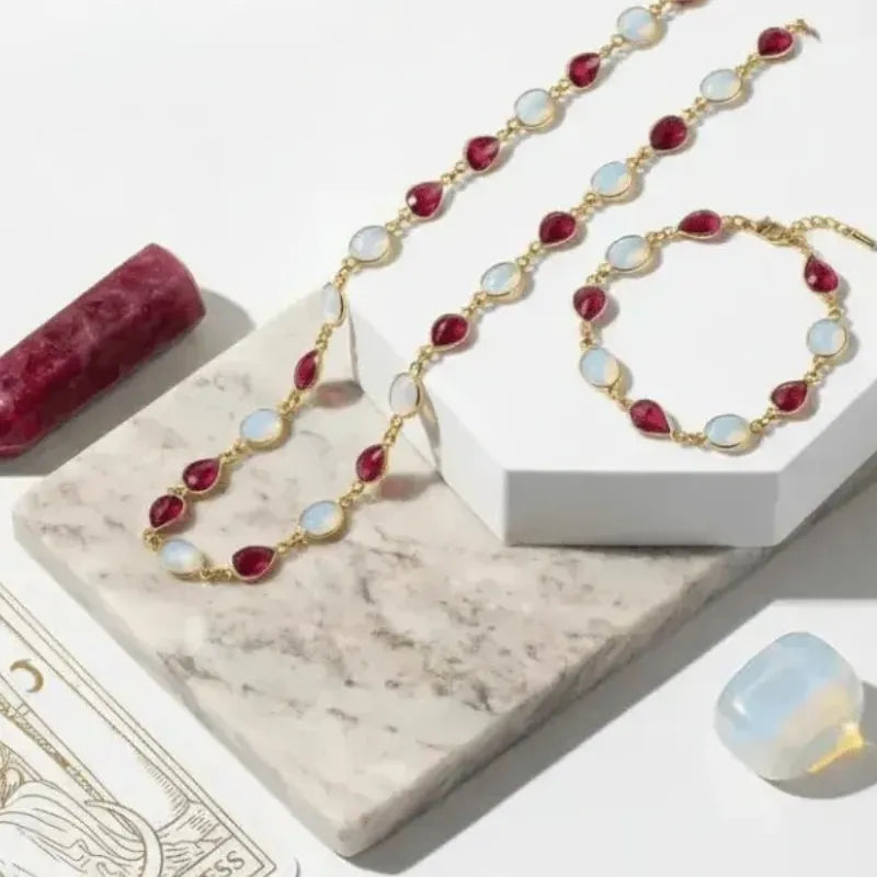 Jewelry set with necklace and bracelet on a marble surface