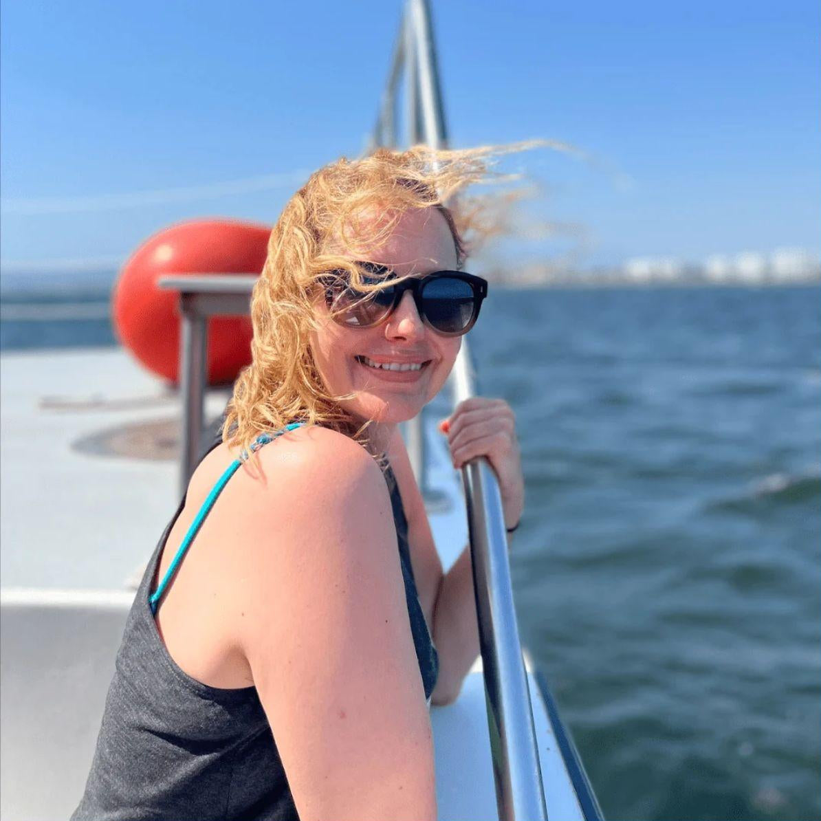andrea of mystic soul jewelry on boat in the ocean