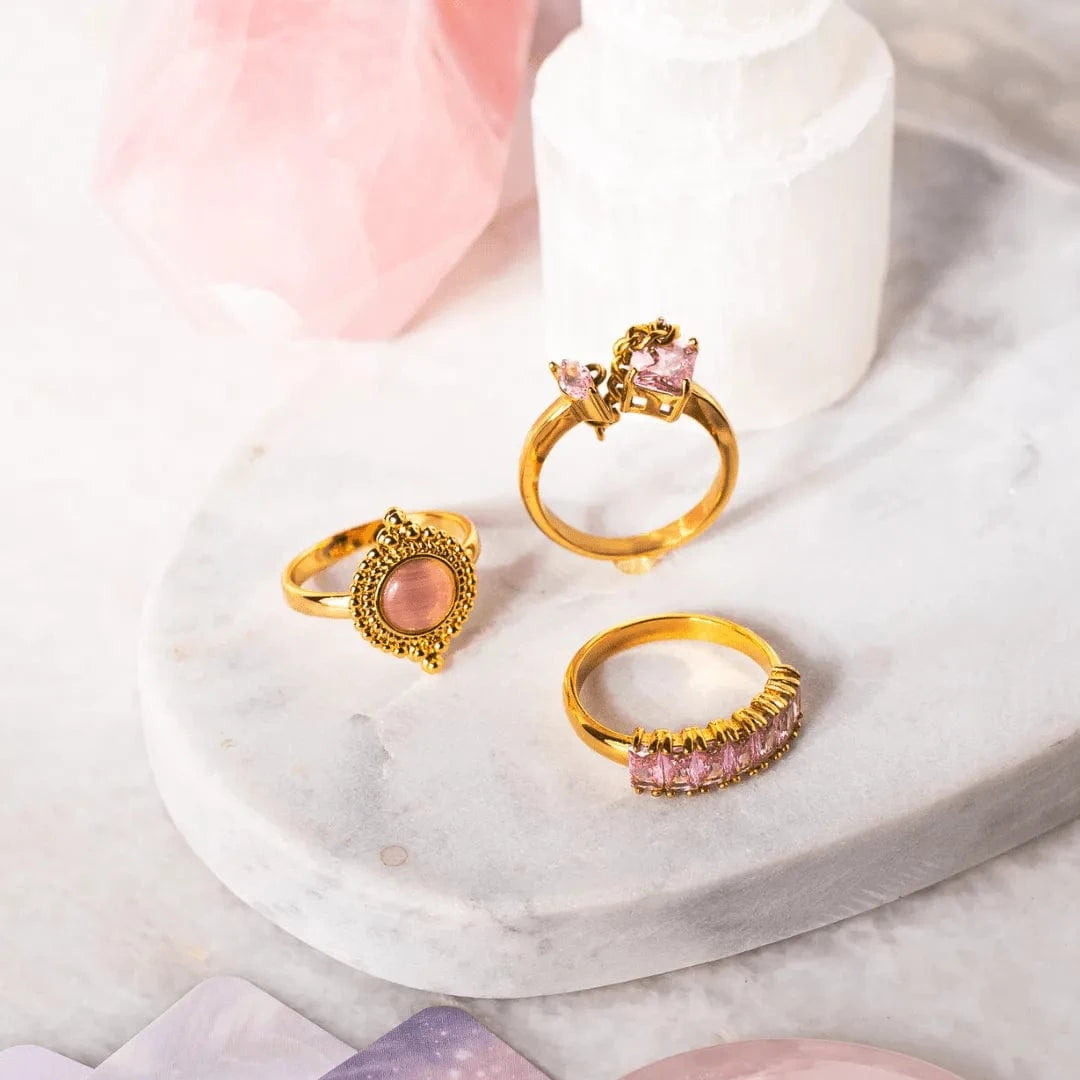 Gold Pink Rings on marble with tarot cards and selenite tower