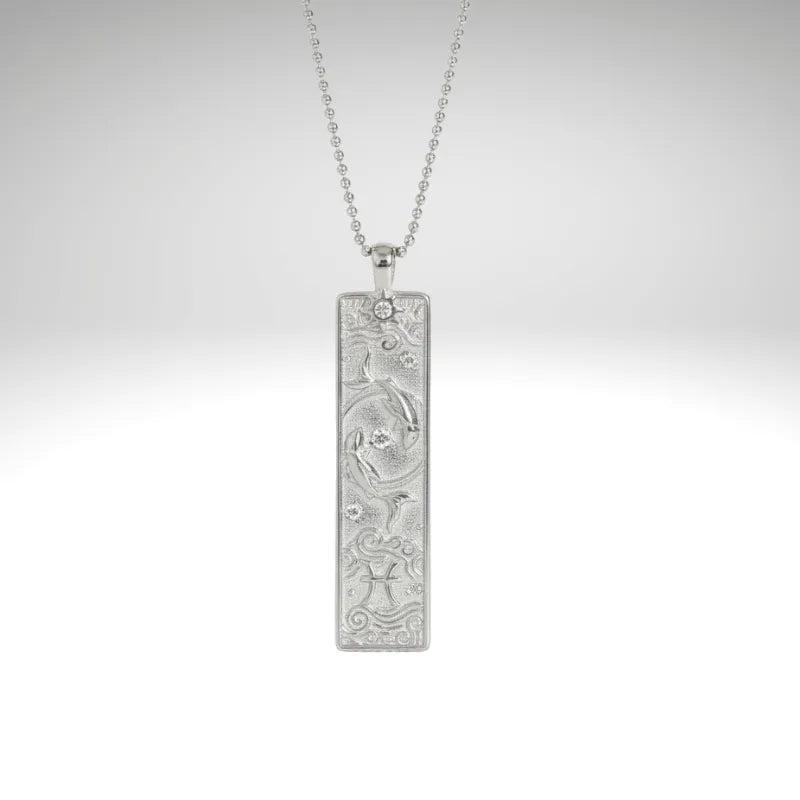 Silver pendant necklace on a light gray background
