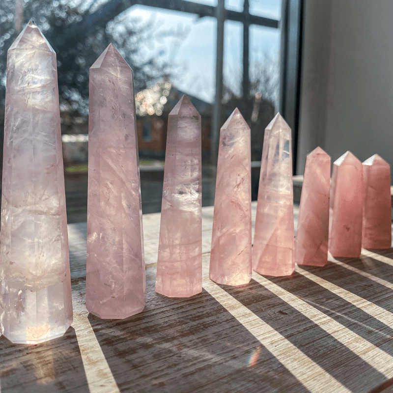 rose quartz towers in a sunbeam recharging crystal ritual