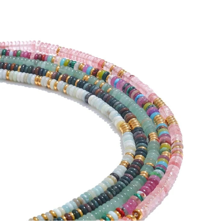Colorful beaded necklaces on a white background