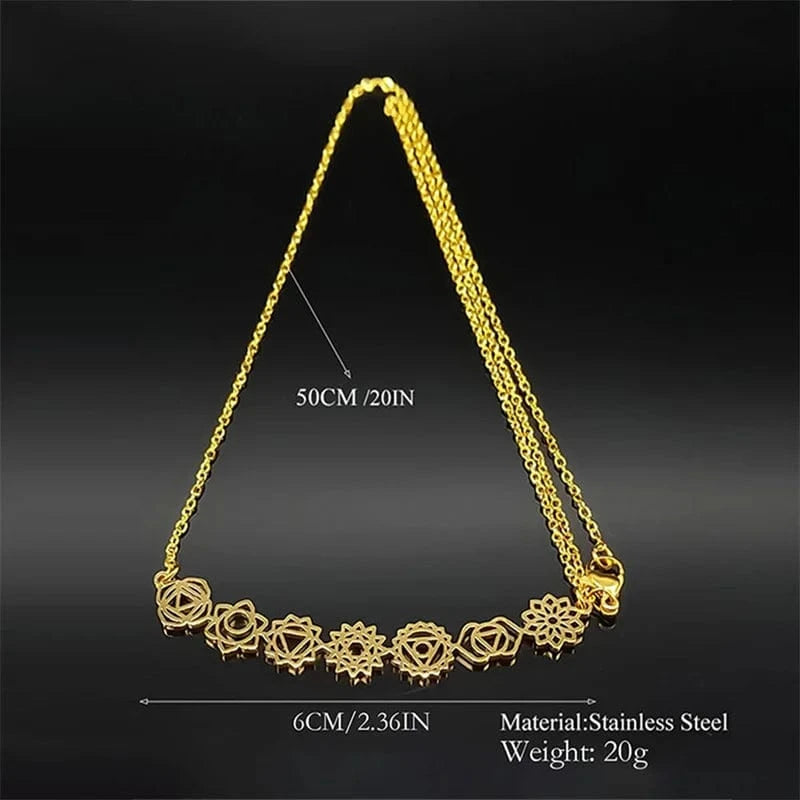 Gold necklace with floral design on a black background