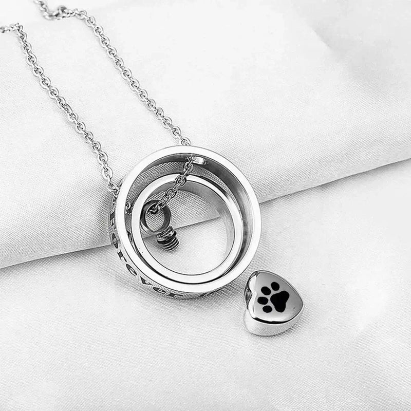 Heart urn necklace with spinning rings and paw print charm, perfect memorial keepsake from Mystic Soul Jewelry.