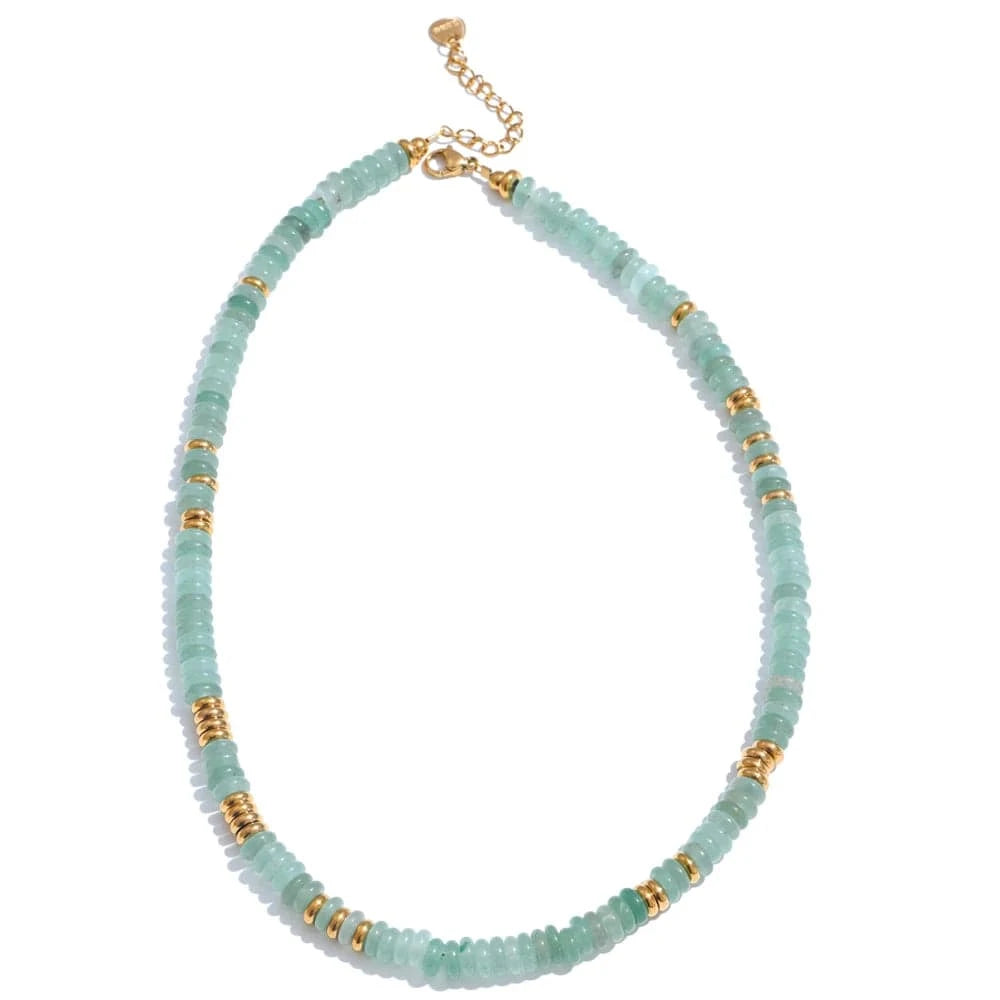 Necklace with light blue beads and gold accents on a white background