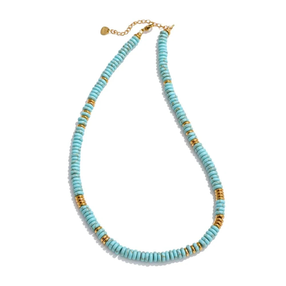 Turquoise beaded necklace with gold accents on a white background