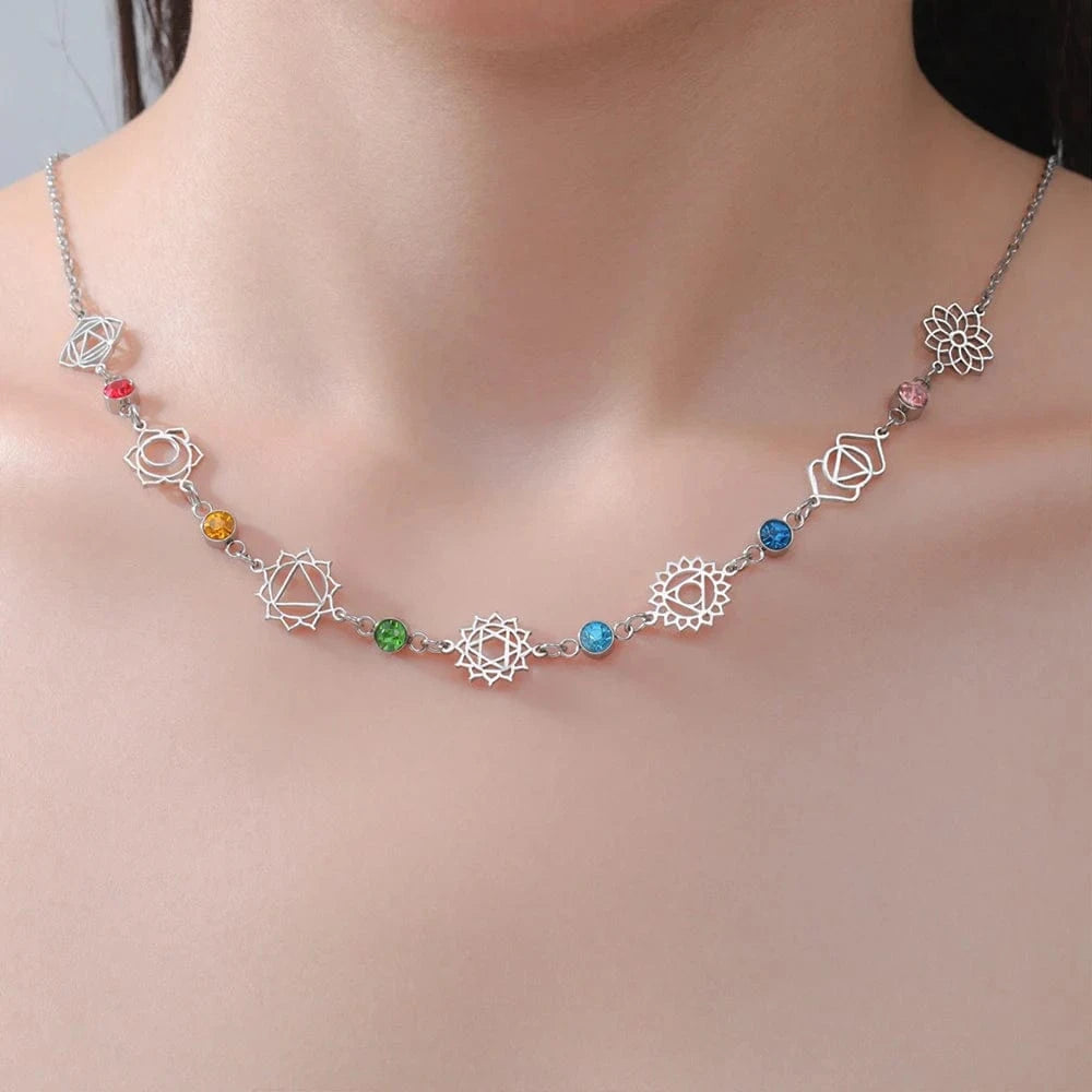 Necklace with colorful beads on a plain background