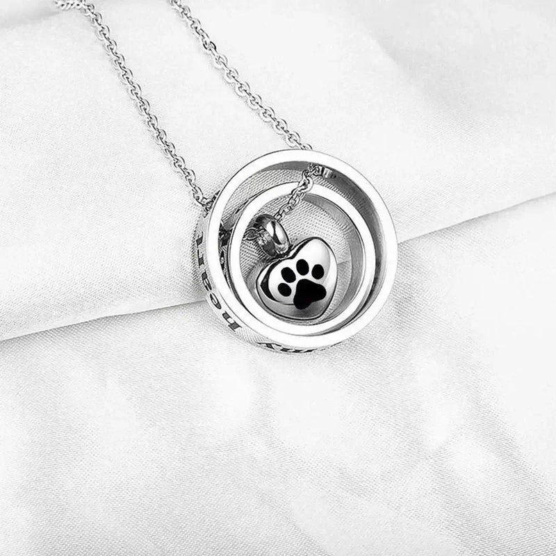 Heart urn necklace with paw print, spinning memorial keepsake by Mystic Soul Jewelry.