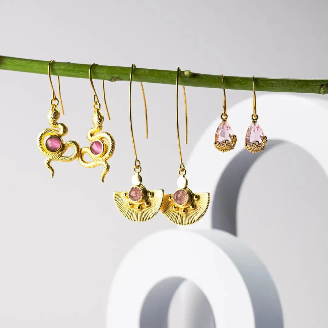 Snake earrings with pink cats eye