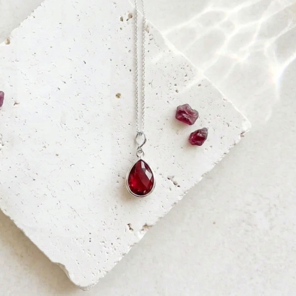 Silver teardrop pendant necklace with ruby red faceted glass drop, July birthstone colour