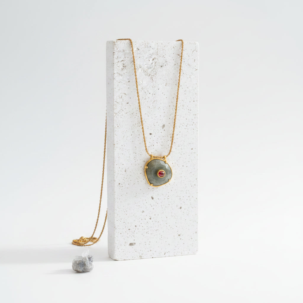Agate pendant necklace hanging, showing the gold rope chain