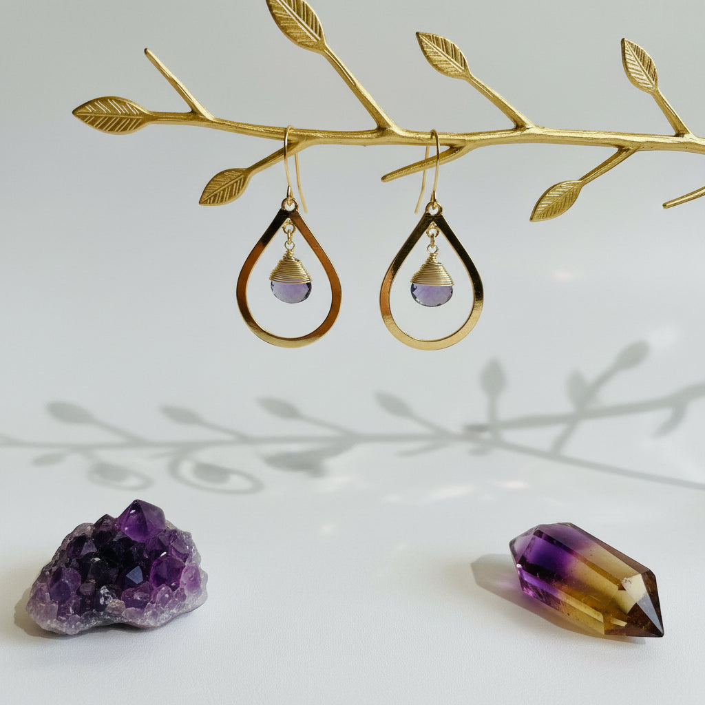 Gold bold teardrop earrings with faceted amethyst drops