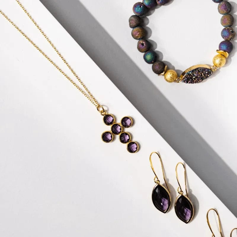 Jewelry set with necklace, bracelet, and earrings on a white surface