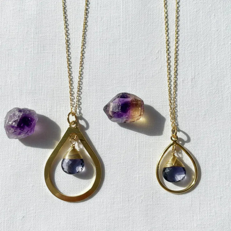 Genuine faceted amethyst drop necklaces in thin and thick gold styles side by side, February birthstone jewelry