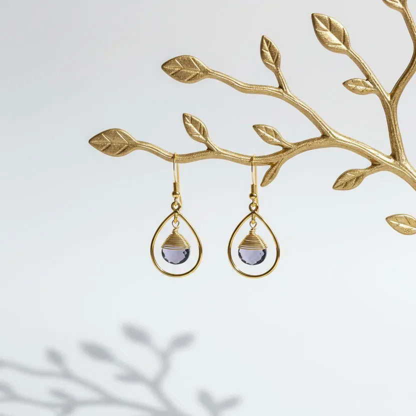 Gold fine hoop earrings with faceted amethyst drops