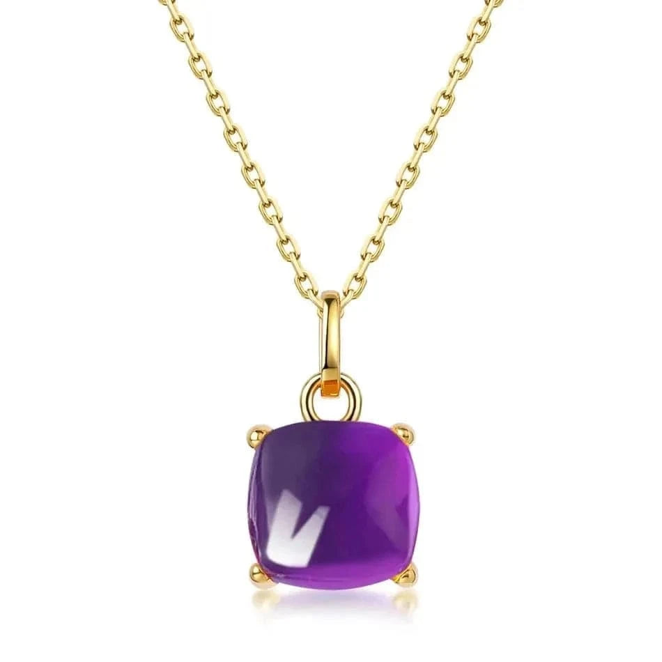 Gold necklace with a purple gemstone pendant on a white background