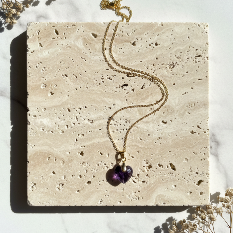 Gold plated amethyst heart necklace flat lay with fine chain, February birthstone jewelry