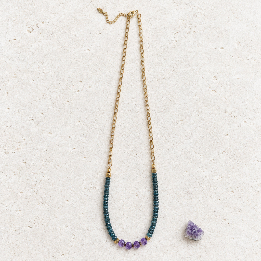 Full length of the amethyst and teal kyanite necklace on its gold-plated chain with a small amethyst beside it