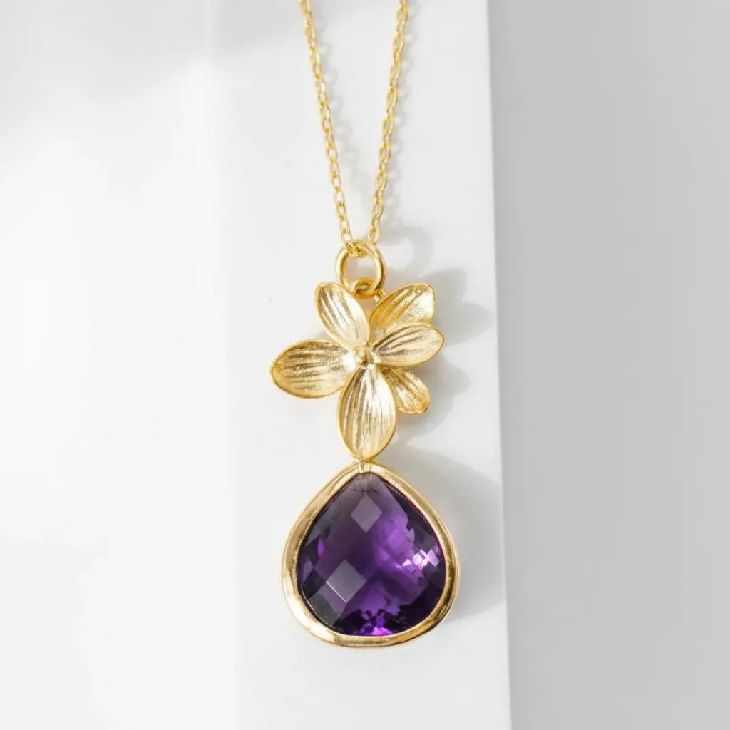 Gold plated orchid glass drop necklace with an amethyst purple faceted drop