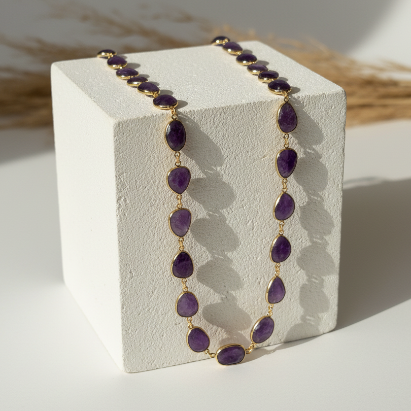 Natural amethyst oval necklace draped on gold plated links, February birthstone