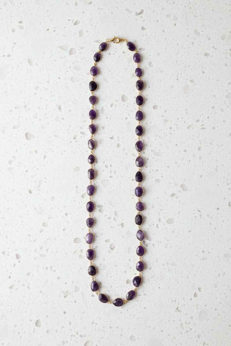Full view of 32 inch natural amethyst oval necklace on gold plated links, February birthstone