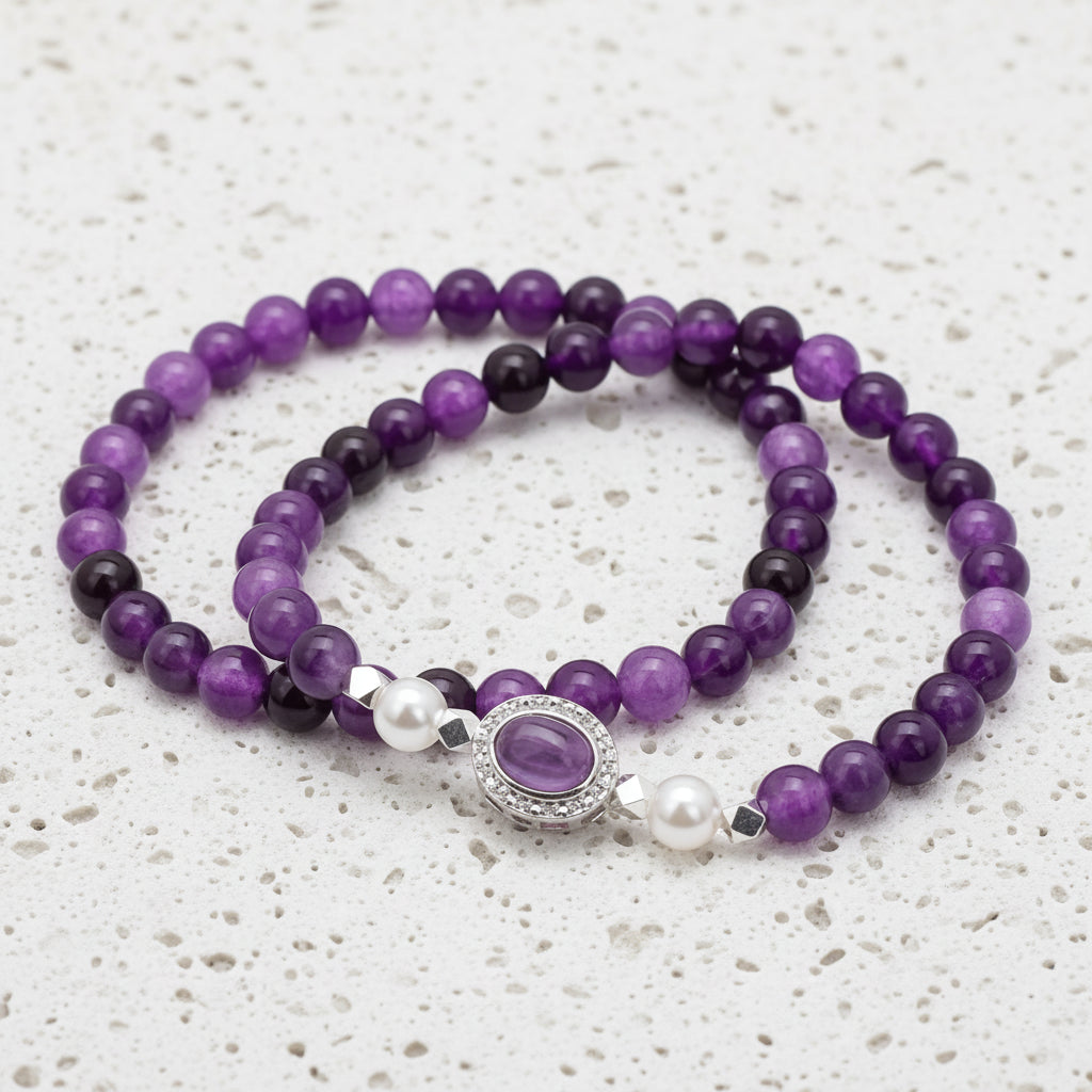 Purple beaded bracelet with a silver clasp on a white background