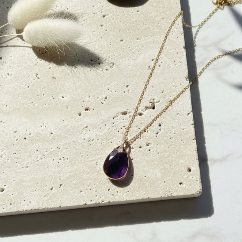 Faceted amethyst pendant necklace on a gold chain — third eye and crown chakra jewelry