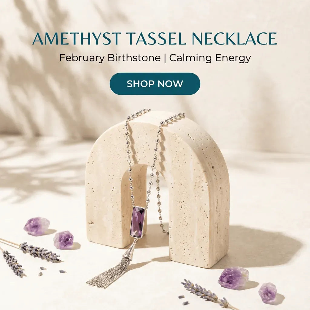 Amethyst tassel necklace on a stone stand with lavender flowers, featuring text about February birthstone and calming energy.