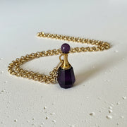 Amethyst crystal vial necklace with unscrewing gold top on gold plated chain, February birthstone keepsake