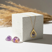 Gold amethyst drop necklace with a hand wire-wrapped faceted stone