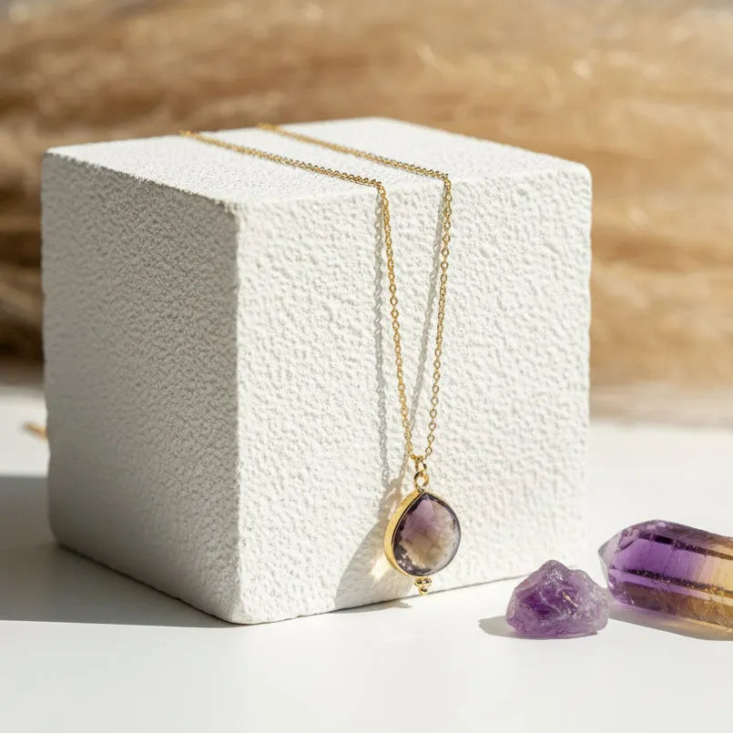 Ametrine pendant necklace in the dot design hanging on a gold chain