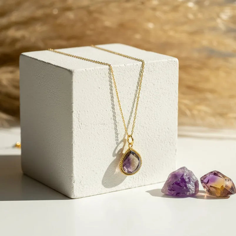 Ametrine pendant necklace in the detailed edge design hanging on a gold chain