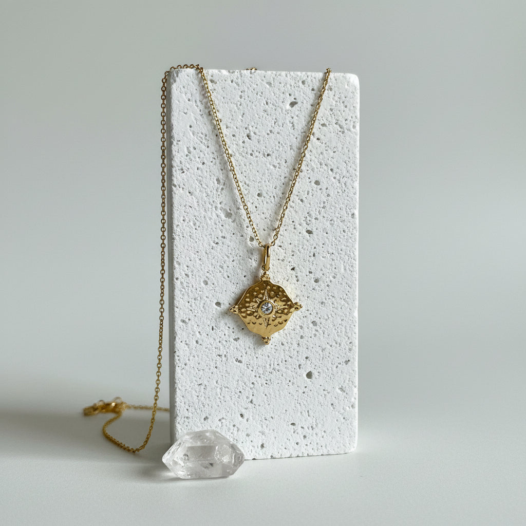 Gold hammered medallion necklace with clear diamond-style CZ centre, April birthstone jewelry