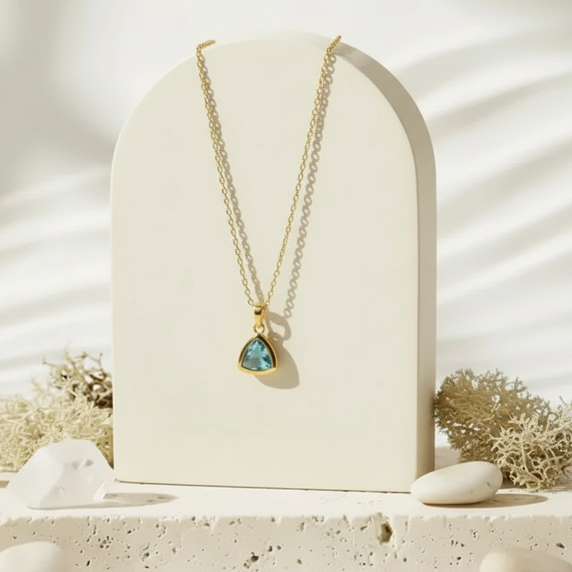 Gold Aria necklace with aqua faceted glass triangle pendant, March birthstone jewelry