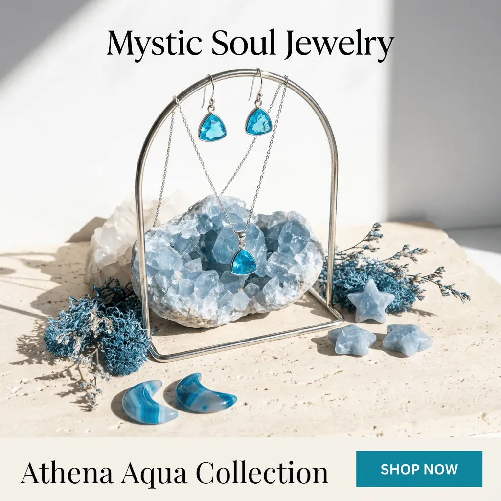 Mystic Soul Jewelry Athena Aqua Collection with blue earrings and crystal on a light background
