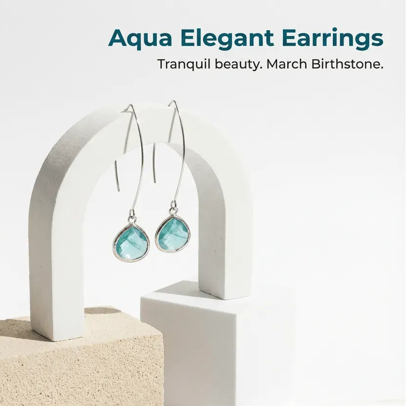Aqua elegant earrings displayed on a white stand with a beige block background.