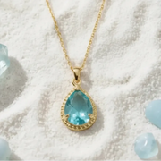 Aqua blue teardrop pendant necklace in gold, March birthstone jewelry