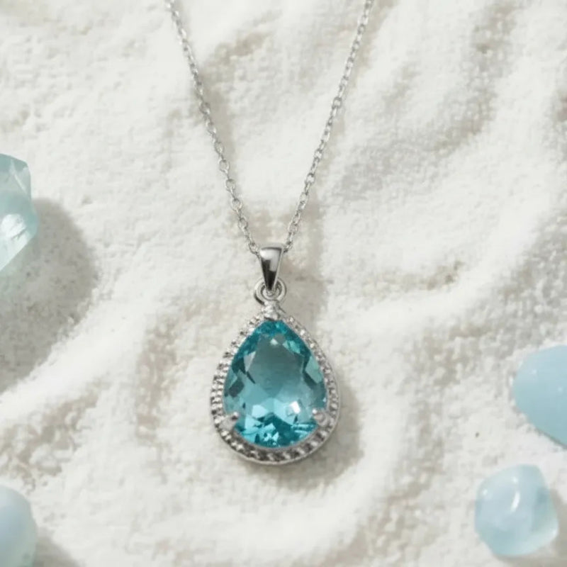 Aqua blue teardrop pendant necklace in silver, March birthstone jewelry