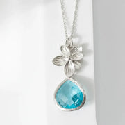 Silver plated orchid glass drop necklace with an aqua blue faceted glass drop