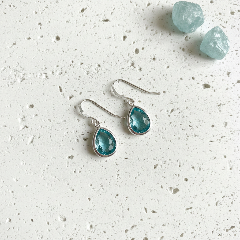Aqua blue faceted glass drop earrings in silver plated brass