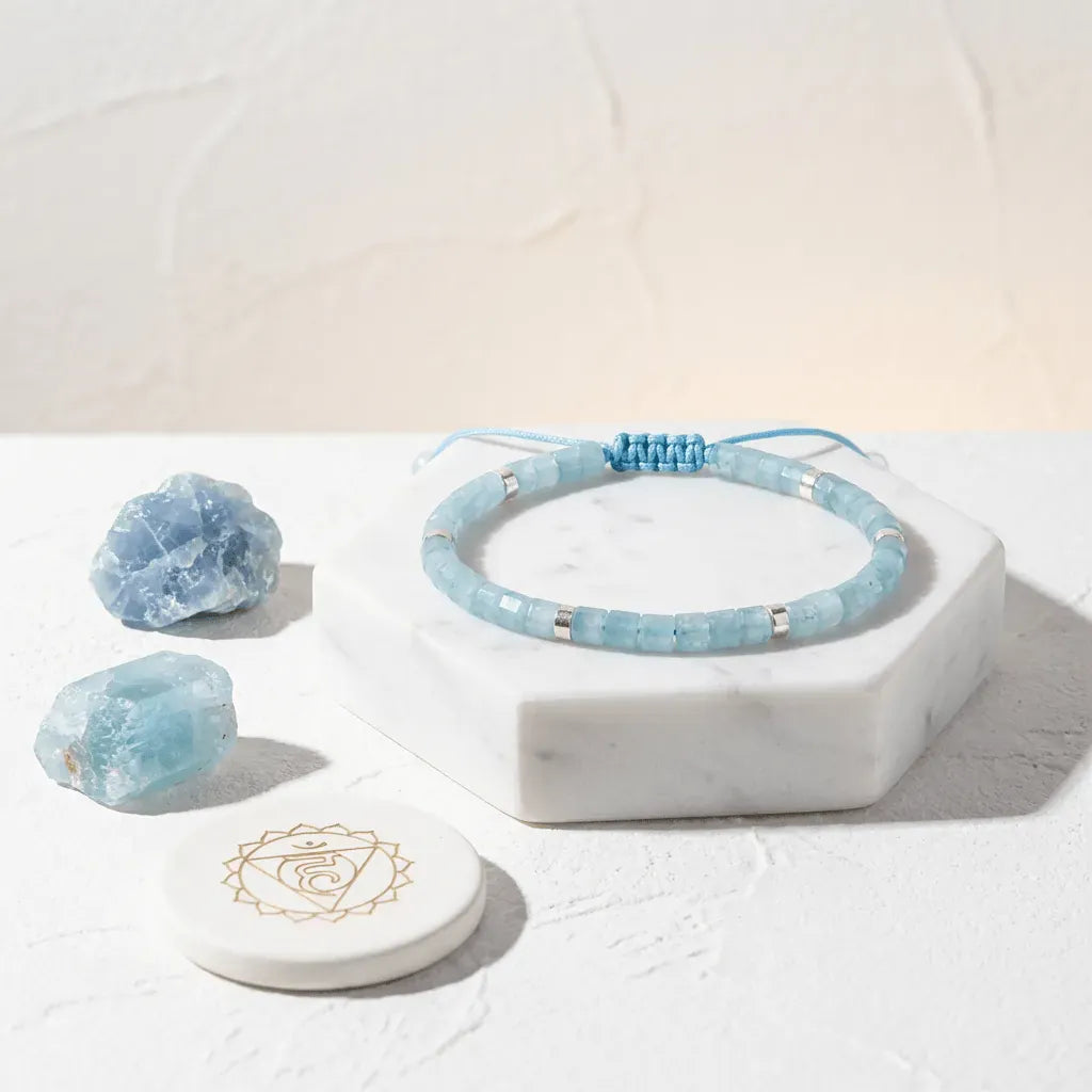 Blue beaded bracelet with crystals on a white surface