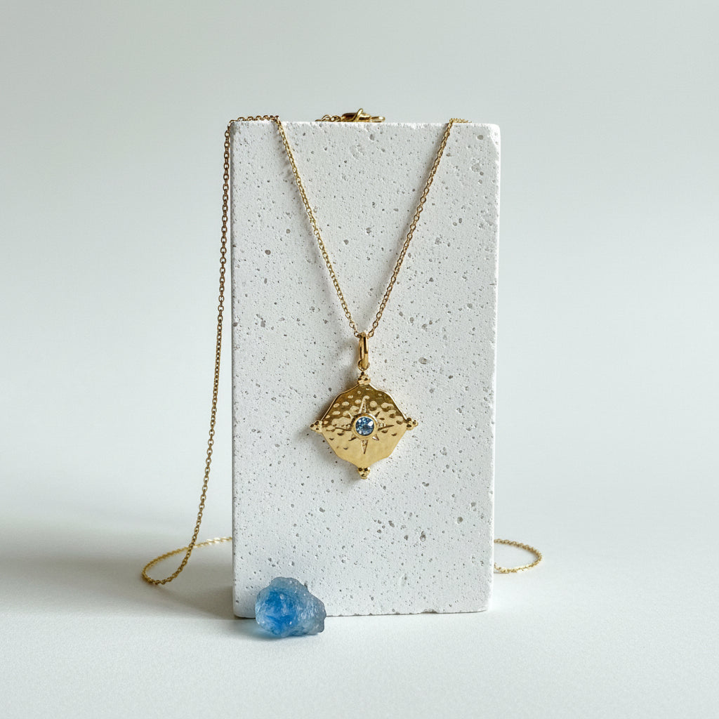 Gold hammered medallion necklace with teal aquamarine CZ centre, March birthstone jewelry