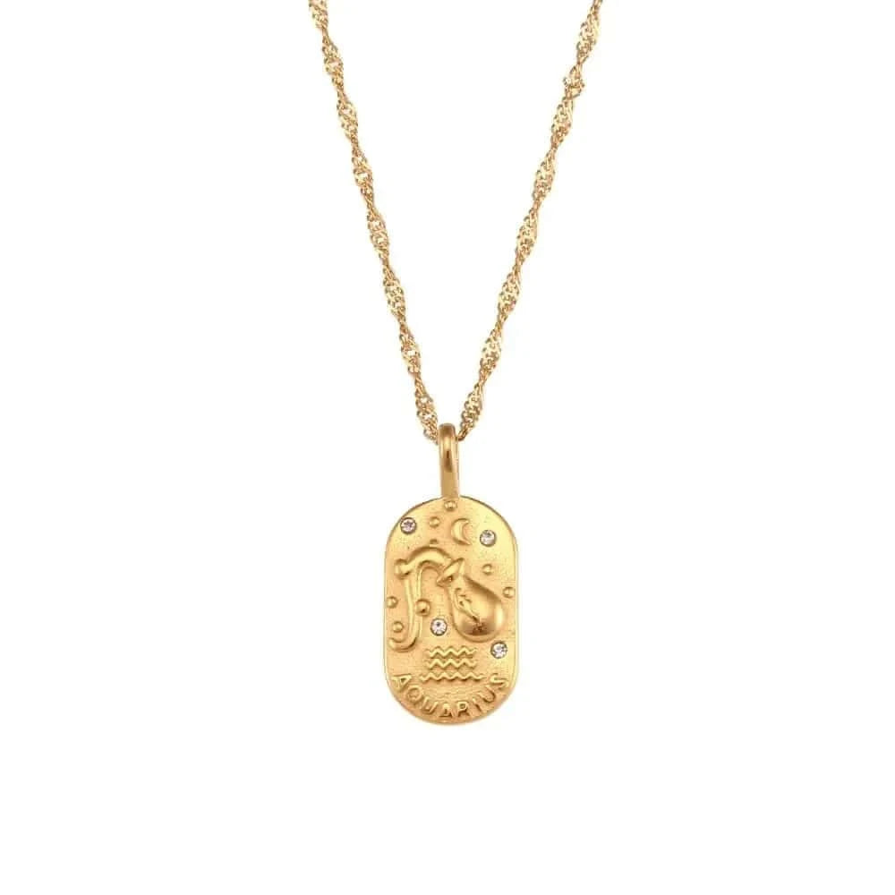 Gold necklace with a zodiac pendant on a white background