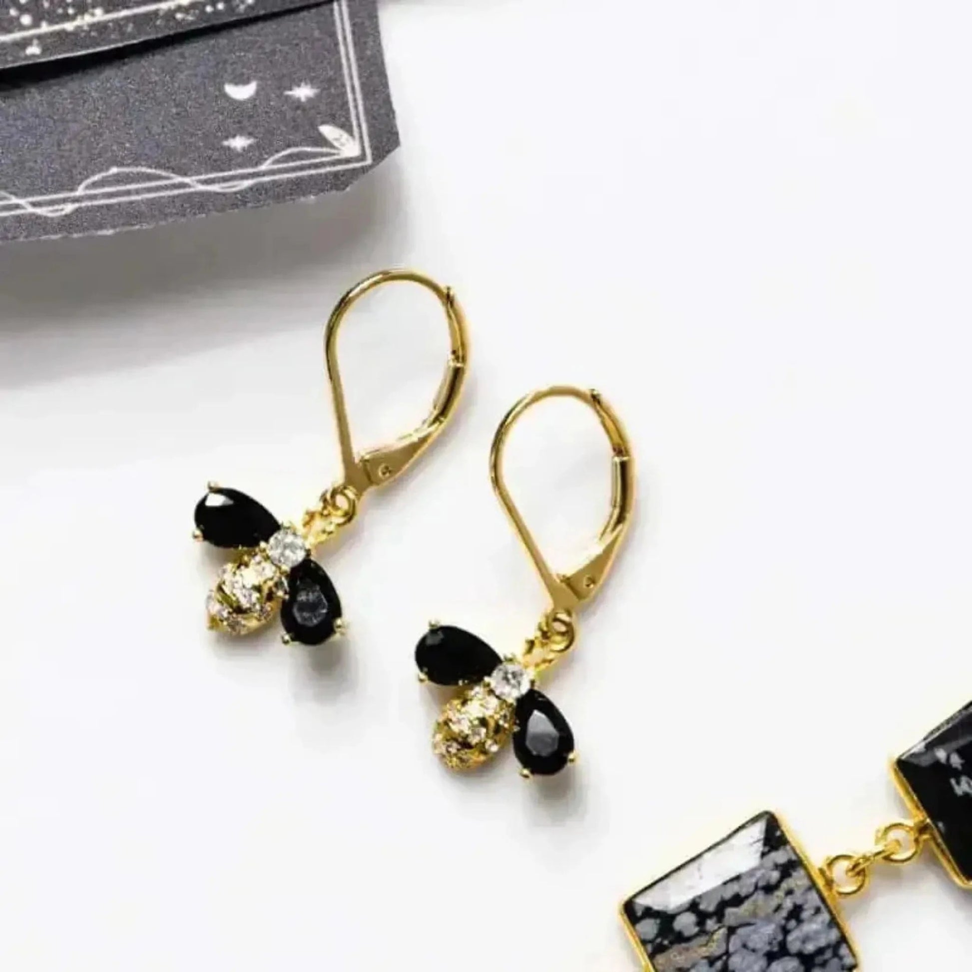 bee earrings in black gold
