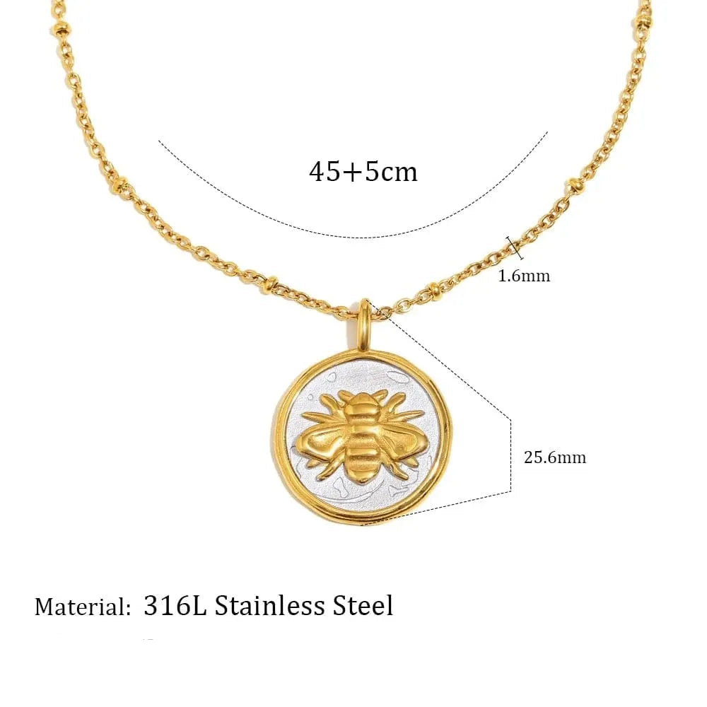 Gold necklace with bee pendant and measurement details on a white background
